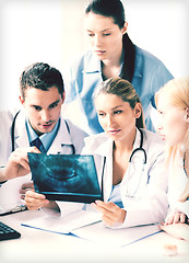 Image showing young group of doctors looking at x-ray