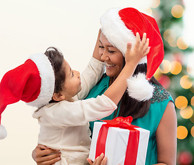 Image showing happy mother and child girl with gift box