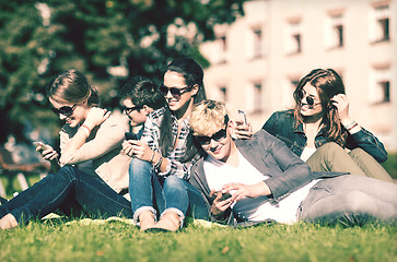 Image showing students looking at smartphones and tablet pc