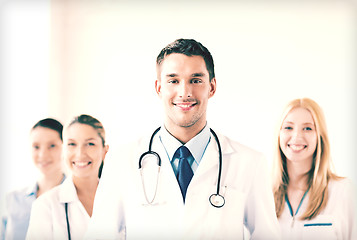 Image showing male doctor in front of medical group