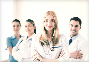 Image showing female doctor in front of medical group