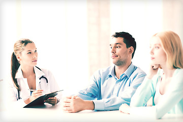 Image showing doctor with patients in cabinet