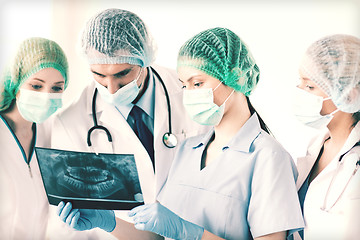 Image showing young group of doctors looking at x-ray