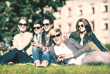 Image showing students looking at smartphones and tablet pc