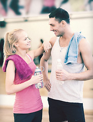 Image showing two smiling people in the gym