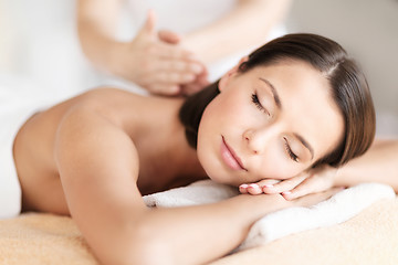 Image showing beautiful woman in spa salon getting massage