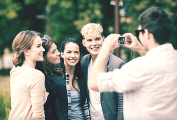 Image showing teenagers taking photo outside