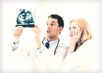 Image showing two doctors looking at x-ray