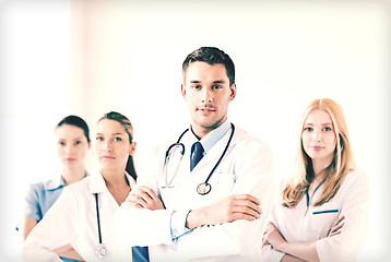 Image showing male doctor in front of medical group