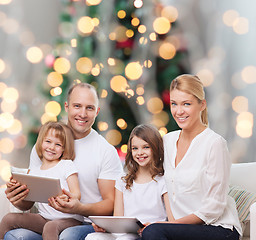 Image showing happy family with tablet pc computers