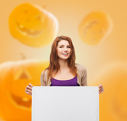 Image showing smiling teenage with white board