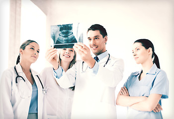 Image showing young group of doctors looking at x-ray