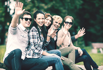 Image showing group of students or teenagers waving hands