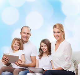 Image showing happy family with tablet pc computers