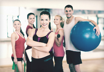 Image showing woman standing in front of the group in gym