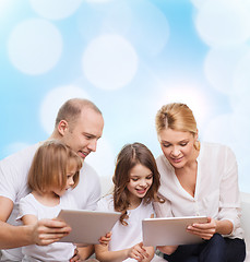 Image showing happy family with tablet pc computers