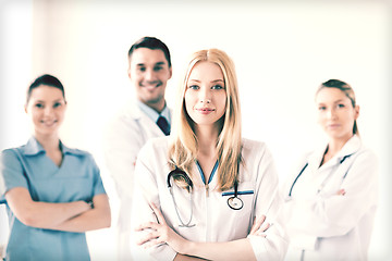 Image showing female doctor in front of medical group