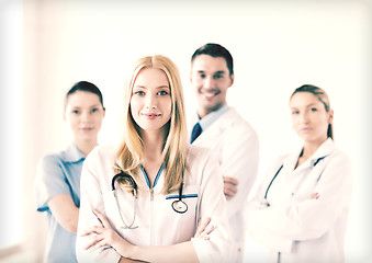 Image showing female doctor in front of medical group