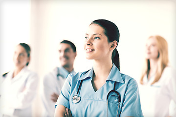 Image showing female doctor in front of medical group