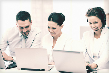 Image showing group of people working with laptops in office