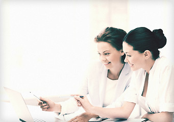 Image showing businesswomen working with laptop in office