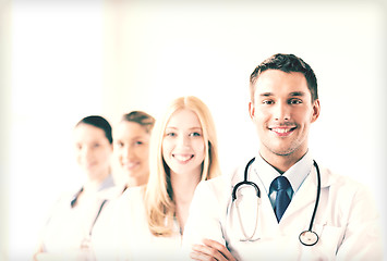 Image showing male doctor in front of medical group