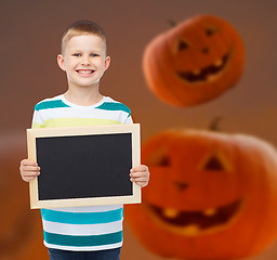 Image showing smiling little boy with black board