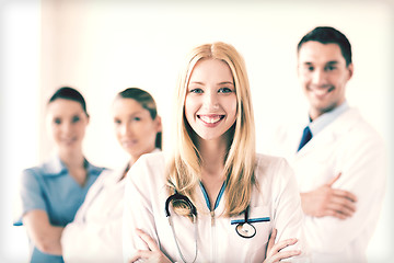 Image showing female doctor in front of medical group