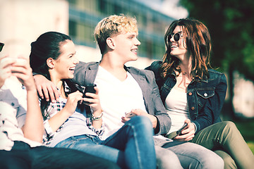 Image showing students looking at smartphones and tablet pc