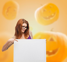 Image showing smiling teenage girl in glasses with white board