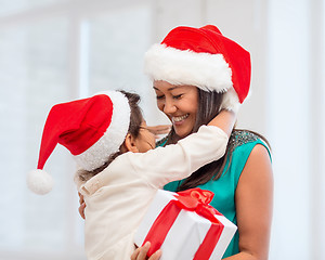 Image showing happy mother and child girl with gift box