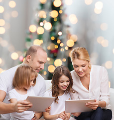 Image showing happy family with tablet pc computers