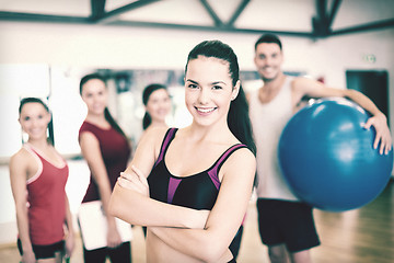 Image showing woman standing in front of the group in gym