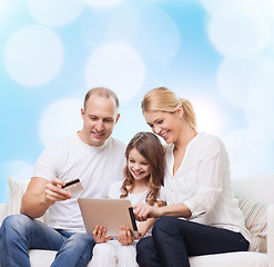 Image showing happy family with tablet pc and credit card