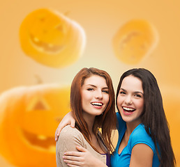 Image showing smiling teenage girls hugging