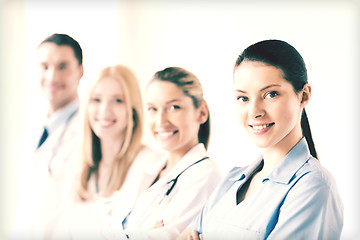 Image showing female doctor in front of medical group