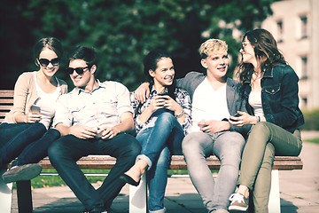 Image showing students looking at smartphones and tablet pc