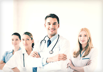 Image showing male doctor in front of medical group