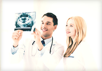 Image showing two doctors looking at x-ray