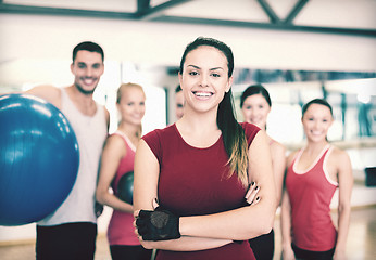 Image showing woman standing in front of the group in gym