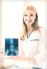 Image showing female doctor with x-ray on tablet pc