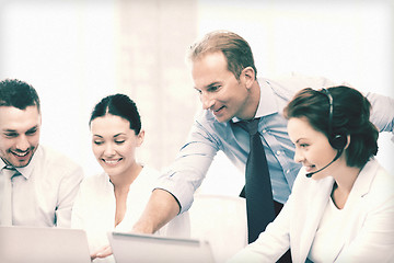 Image showing group of people working in call center