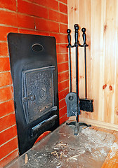 Image showing Set of cast iron objects near the stove in the Russian bath