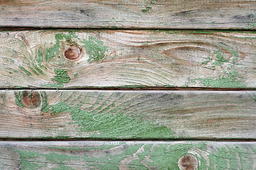 Image showing Texture of wall made of planks with paint peeling off close-up