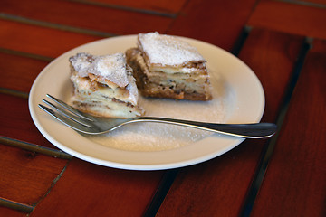 Image showing Two pieces of baklava on the plate with a fork