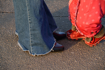 Image showing being together conceipt: a baby girl legs and mother legs