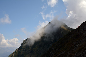 Image showing A cloudon the top of the mountain