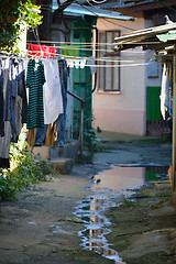 Image showing Small backyard woth poor houses