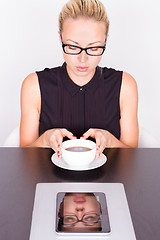 Image showing Business woman with cup of coffee.