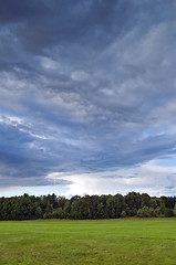 Image showing Landscape with grey clouds and green grass